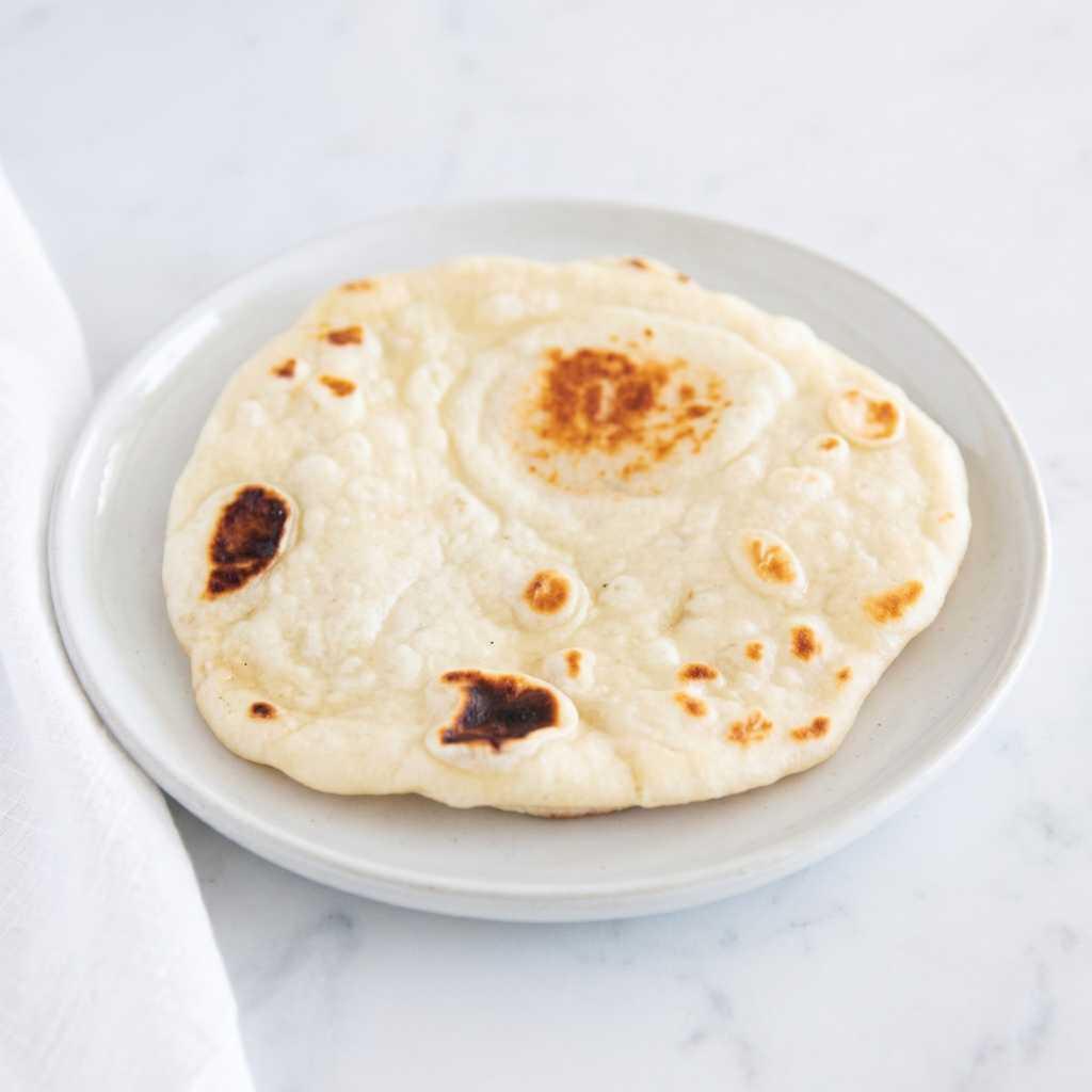 Warm naan at Ribs 'n' Kabobs in Artesia, CA, the classic side for RNK Foods seekh kabobs